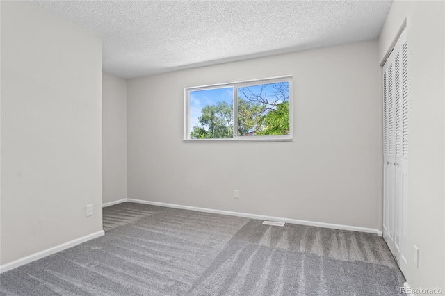 6240 W 110th Pl, Westminster, CO 80020 - unfurnished bedroom featuring carpet, a textured ceiling, and a closet