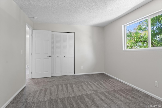 6240 W 110th Pl, Westminster, CO 80020 - unfurnished bedroom featuring carpet flooring, a textured ceiling, and a closet