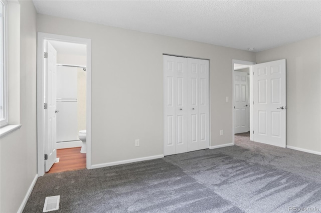 6240 W 110th Pl, Westminster, CO 80020 - unfurnished bedroom with carpet floors, a closet, a textured ceiling, and ensuite bath