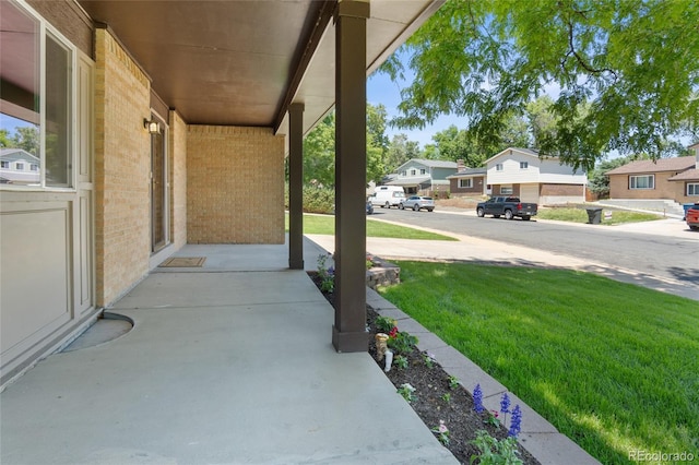 6240 W 110th Pl, Westminster, CO 80020 - covered porch featuring a residential view and a yard