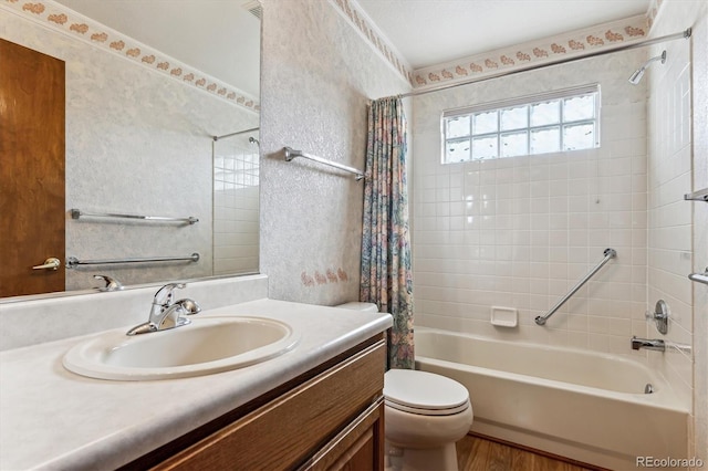 full bathroom with vanity, wood-type flooring, shower / bathtub combination with curtain, and toilet