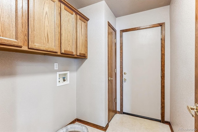 laundry area with cabinets and hookup for a washing machine