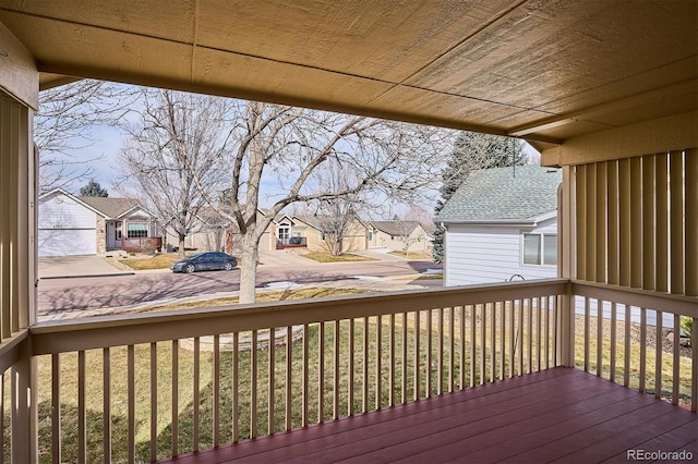 wooden deck featuring a yard