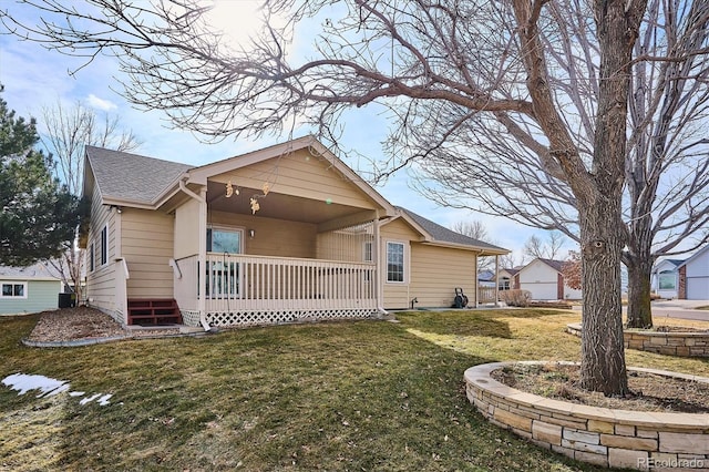 view of front of house with a front yard and a porch