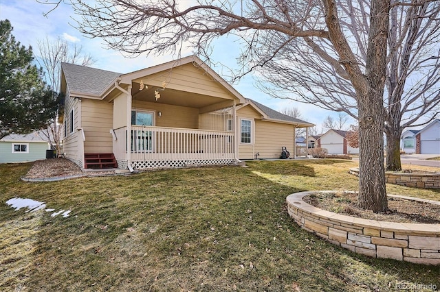 exterior space featuring covered porch and a front lawn