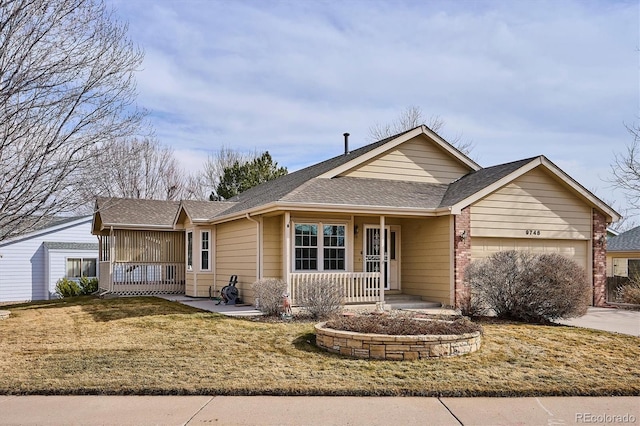 view of front facade featuring a porch, a garage, and a front yard