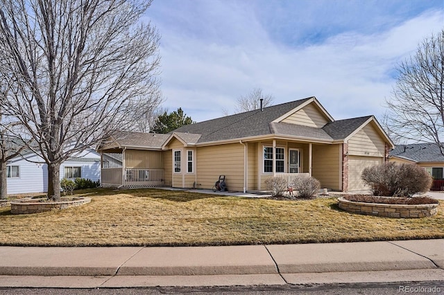 ranch-style house featuring a porch, a garage, and a front lawn