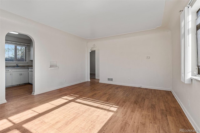 empty room featuring light hardwood / wood-style floors and sink