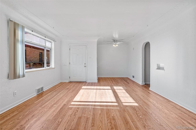 empty room featuring ceiling fan and light wood-type flooring