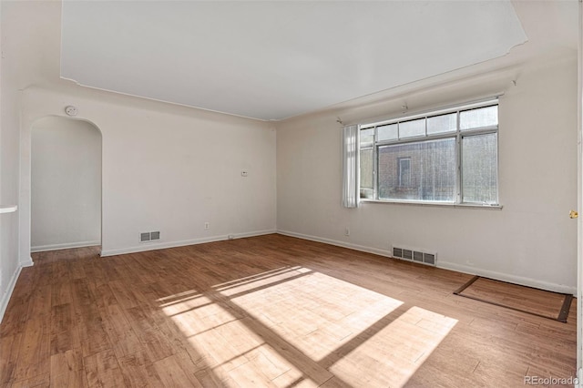 spare room featuring light wood-type flooring