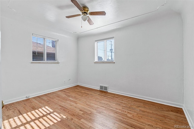 unfurnished room featuring hardwood / wood-style flooring and ceiling fan