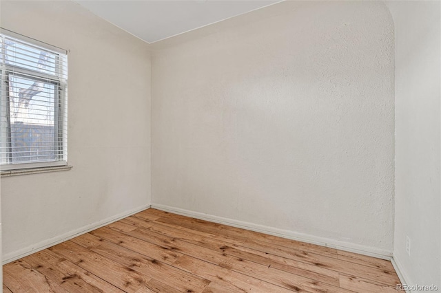 spare room with light wood-type flooring