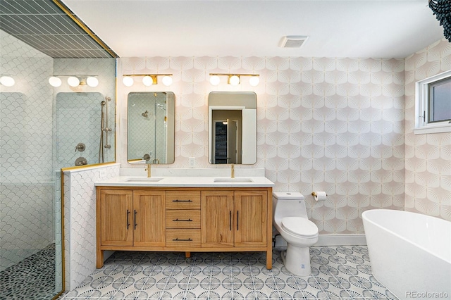 4258 Tennyson St Unit 101, Denver, CO 80212 - bathroom with a freestanding tub, double vanity, a tile shower, and tile patterned flooring