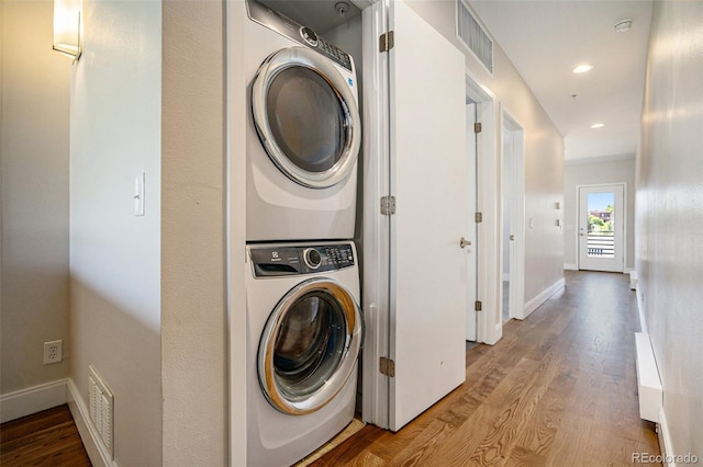 4258 Tennyson St Unit 101, Denver, CO 80212 - laundry room with stacked washer / dryer, wood finished floors, and recessed lighting