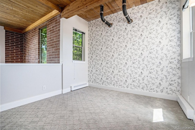 4258 Tennyson St Unit 101, Denver, CO 80212 - empty room with a wood ceiling with exposed beams, a baseboard heating unit, and wallpapered walls