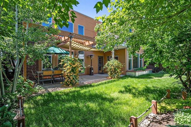 4258 Tennyson St Unit 101, Denver, CO 80212 - rear view of property featuring a patio area, a yard, and a pergola