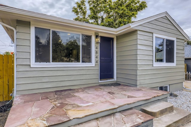 doorway to property featuring a patio area