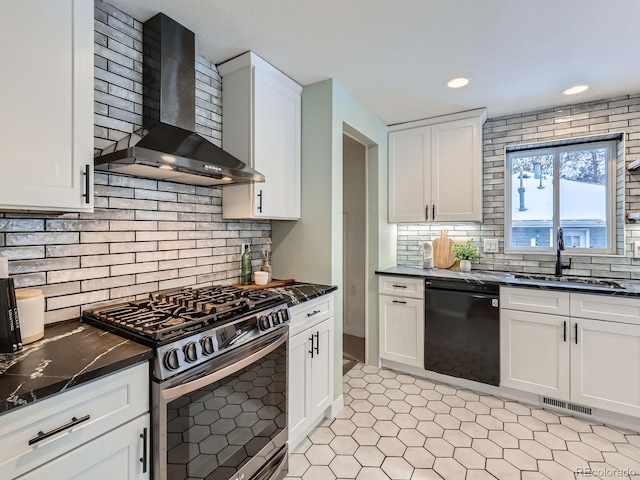 kitchen featuring wall chimney exhaust hood, gas range, sink, white cabinets, and black dishwasher