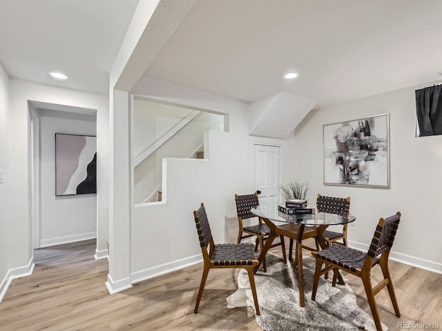 dining space featuring light wood-type flooring