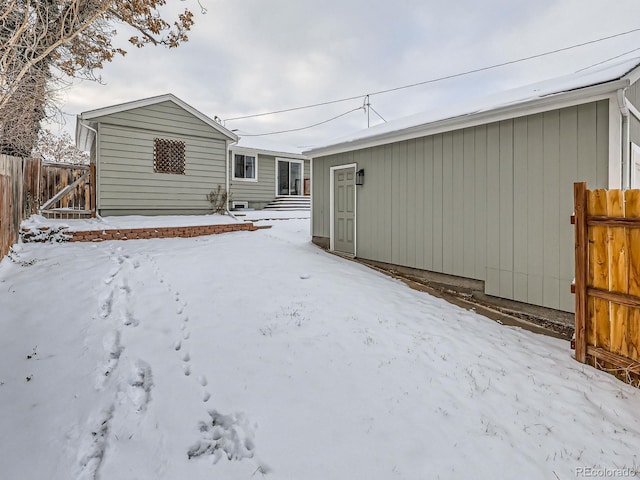 view of snow covered house