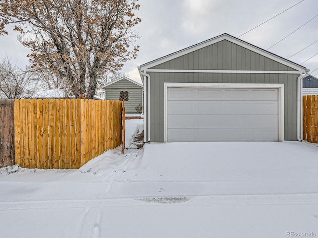 view of snow covered garage