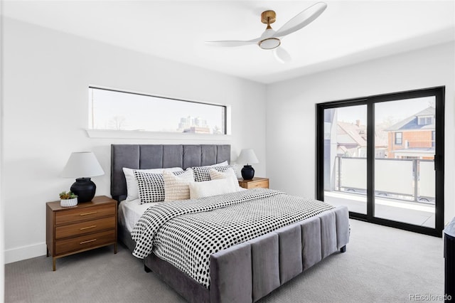 bedroom featuring carpet floors, access to exterior, and a ceiling fan