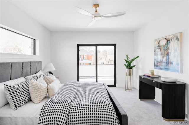 bedroom featuring access to exterior, a ceiling fan, and carpet floors