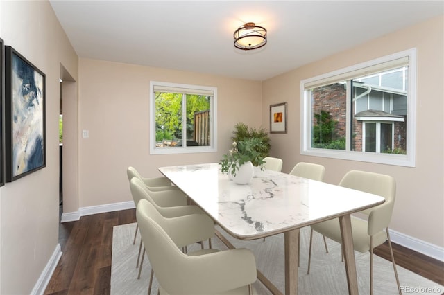 8160 W Phillips Ave, Littleton, CO 80128 - dining space featuring baseboards and dark wood finished floors
