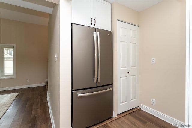 8160 W Phillips Ave, Littleton, CO 80128 - kitchen with freestanding refrigerator, dark wood-style flooring, and white cabinetry