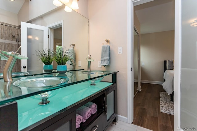 8160 W Phillips Ave, Littleton, CO 80128 - bathroom featuring double vanity and wood finished floors