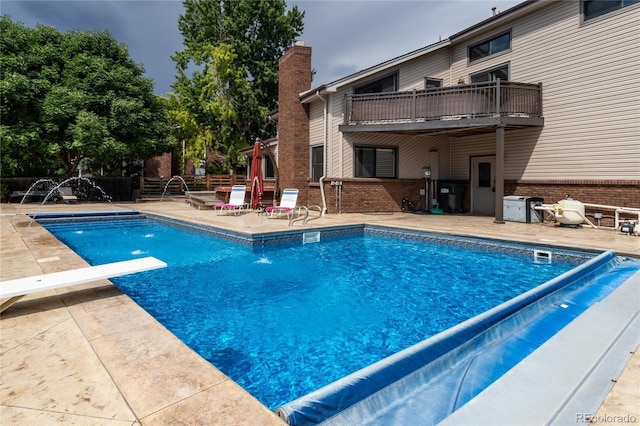 8160 W Phillips Ave, Littleton, CO 80128 - view of pool featuring a patio and a diving board