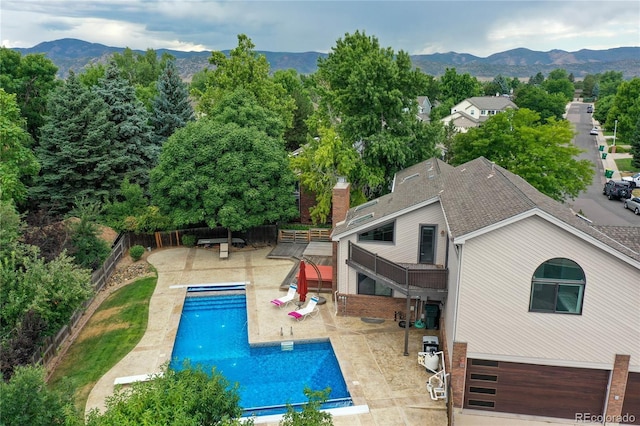 8160 W Phillips Ave, Littleton, CO 80128 - view of swimming pool featuring a fenced backyard, a mountain view, and a patio