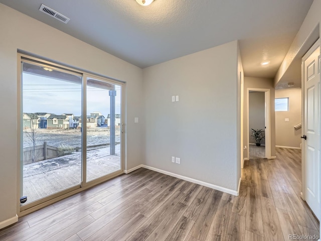 spare room featuring hardwood / wood-style flooring