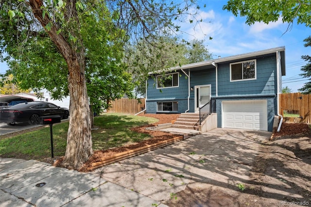 818 Don Juan Ct, Colorado Springs, CO 80909 - bi-level home featuring a garage, driveway, and brick siding
