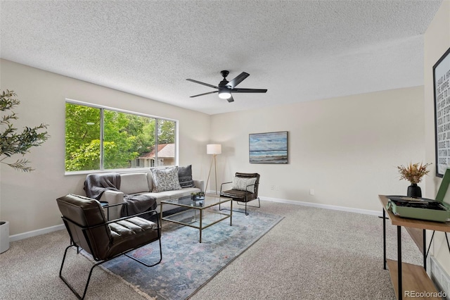 818 Don Juan Ct, Colorado Springs, CO 80909 - living area with ceiling fan, carpet floors, a textured ceiling, and baseboards