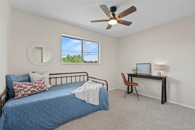 818 Don Juan Ct, Colorado Springs, CO 80909 - carpeted bedroom featuring a textured ceiling, baseboards, and a ceiling fan