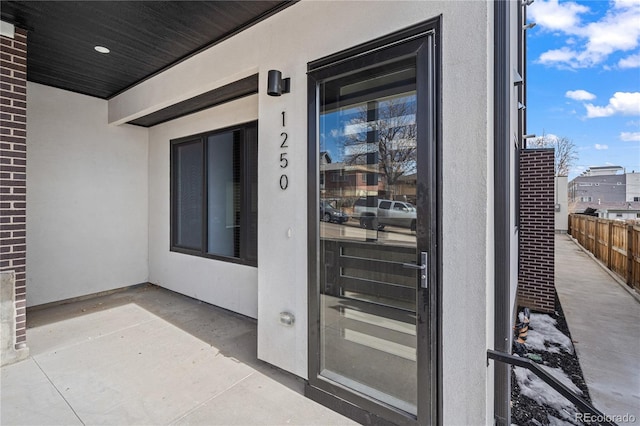 property entrance with a patio