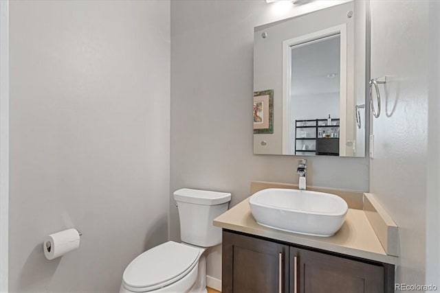 2420 S Gilpin St, Denver, CO 80210 - bathroom featuring toilet and vanity