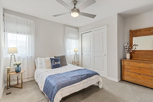 2420 S Gilpin St, Denver, CO 80210 - bedroom with a closet, light colored carpet, and ceiling fan