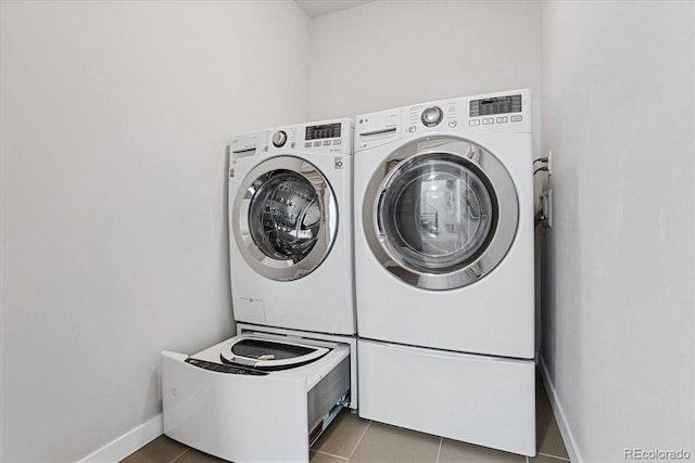 2420 S Gilpin St, Denver, CO 80210 - laundry area featuring tile patterned floors and separate washer and dryer