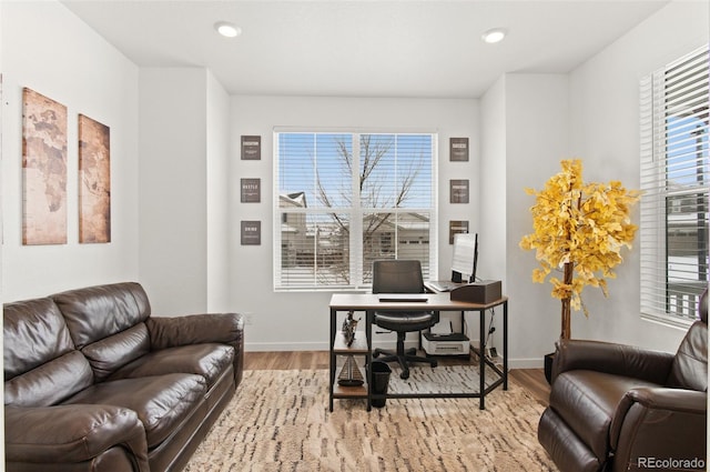 office with light hardwood / wood-style floors