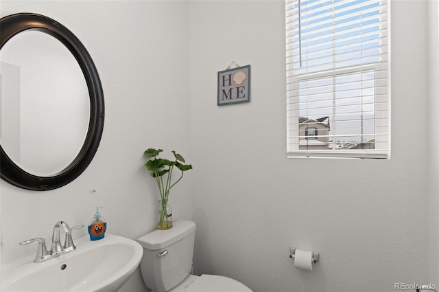 bathroom featuring sink and toilet