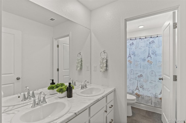 full bathroom with vanity, tile patterned flooring, shower / bath combo, and toilet