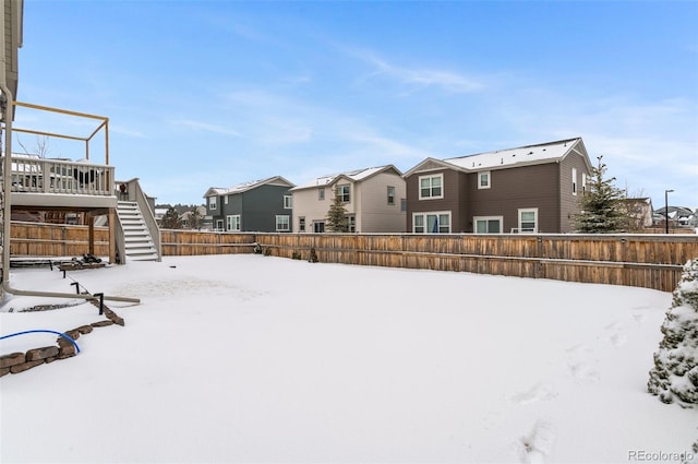 view of yard layered in snow