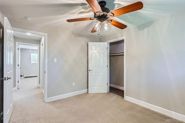 4812 W 8th Ave, Denver, CO 80204 - unfurnished bedroom featuring light carpet, a baseboard heating unit, a textured ceiling, a closet, and a ceiling fan