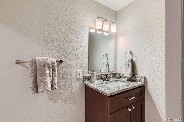 4812 W 8th Ave, Denver, CO 80204 - bathroom featuring vanity and a textured wall
