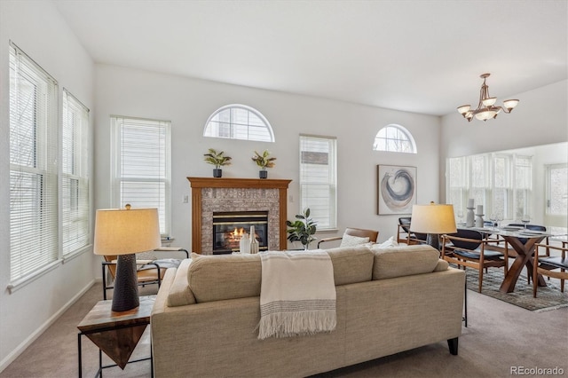 living room with an inviting chandelier and light colored carpet