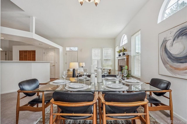 dining space with carpet floors and a wealth of natural light