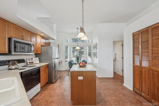 kitchen featuring sink, hanging light fixtures, light tile patterned floors, appliances with stainless steel finishes, and a kitchen island