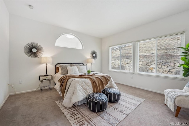 bedroom with light colored carpet